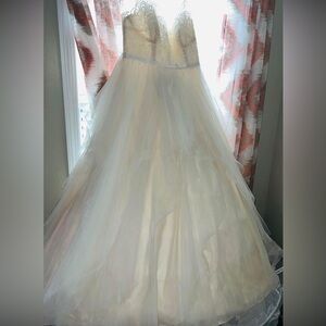Beautiful ivory wedding dress with train length beaded veil and rhinestones pin